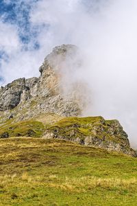 Preview wallpaper rock, cliff, fog, clouds, grass