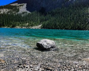 Preview wallpaper rock, cliff, lake, pebbles