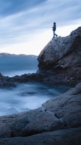 Preview wallpaper rock, cliff, man, sea, loneliness, water