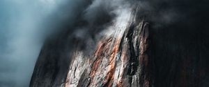 Preview wallpaper rock, cliff, relief, clouds, dark
