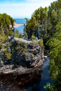 Preview wallpaper rock, cliff, river, landscape, trees