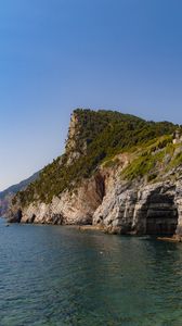 Preview wallpaper rock, cliff, sea, trees, sky