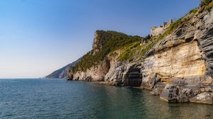 Preview wallpaper rock, cliff, sea, trees, sky