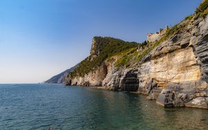 Preview wallpaper rock, cliff, sea, trees, sky