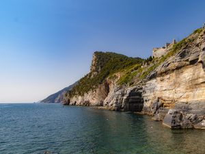 Preview wallpaper rock, cliff, sea, trees, sky