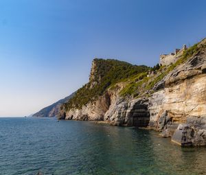 Preview wallpaper rock, cliff, sea, trees, sky