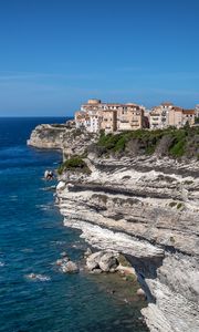 Preview wallpaper rock, cliff, sea, buildings, houses