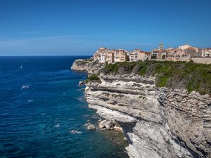 Preview wallpaper rock, cliff, sea, buildings, houses