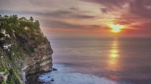 Preview wallpaper rock, cliff, shore, sun, waves