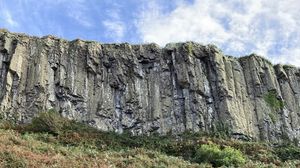 Preview wallpaper rock, cliff, stones, bushes