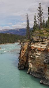 Preview wallpaper rock, cliff, trees, river, landscape, nature