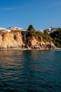 Preview wallpaper rock, cliff, trees, sea, landscape