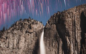 Preview wallpaper rock, cliff, waterfall, starry sky, long exposure, stone