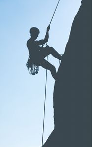 Preview wallpaper rock climber, mountains, rock, silhouette