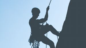 Preview wallpaper rock climber, mountains, rock, silhouette