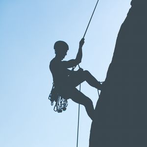 Preview wallpaper rock climber, mountains, rock, silhouette