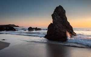 Preview wallpaper rock, coast, sea, waves, twilight, landscape