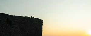 Preview wallpaper rock, couple, clouds, sunset, nature