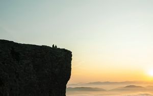 Preview wallpaper rock, couple, clouds, sunset, nature