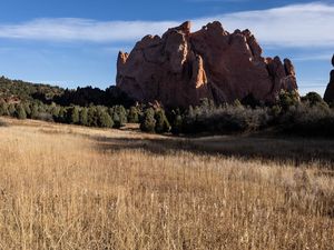 Preview wallpaper rock, field, grass, landscape, nature