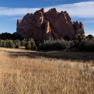 Preview wallpaper rock, field, grass, landscape, nature