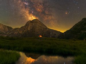 Preview wallpaper rock, grass, pond, milky way, night