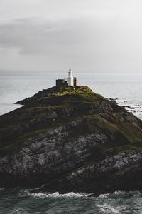 Preview wallpaper rock, hill, lighthouse, sea, coast