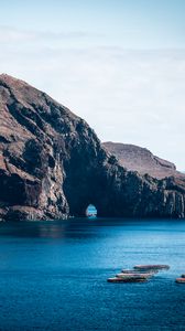 Preview wallpaper rock, island, sea, boats, water