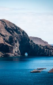 Preview wallpaper rock, island, sea, boats, water