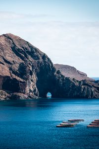 Preview wallpaper rock, island, sea, boats, water