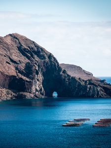 Preview wallpaper rock, island, sea, boats, water