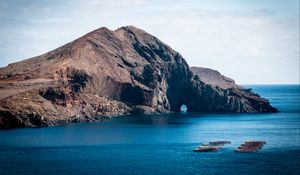 Preview wallpaper rock, island, sea, boats, water