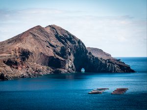 Preview wallpaper rock, island, sea, boats, water