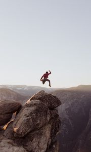 Preview wallpaper rock, jump, freedom, mountains, stones, man