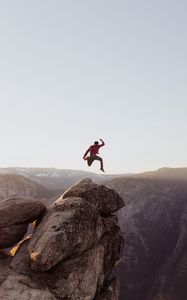 Preview wallpaper rock, jump, freedom, mountains, stones, man