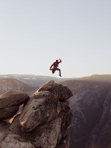 Preview wallpaper rock, jump, freedom, mountains, stones, man