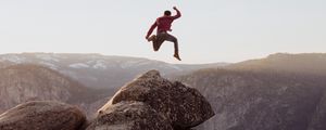 Preview wallpaper rock, jump, freedom, mountains, stones, man