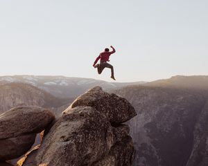 Preview wallpaper rock, jump, freedom, mountains, stones, man