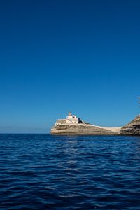 Preview wallpaper rock, lighthouse, sea, nature