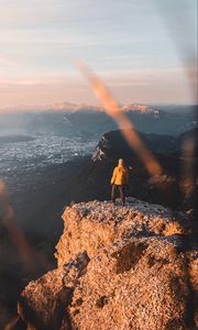 Preview wallpaper rock, man, alone, mountains, peak