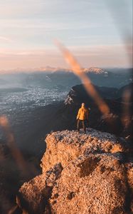 Preview wallpaper rock, man, alone, mountains, peak