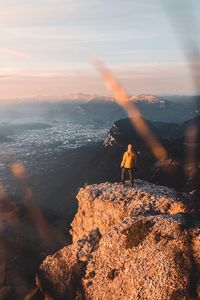 Preview wallpaper rock, man, alone, mountains, peak