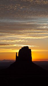 Preview wallpaper rock, mountain, silhouette, sunset