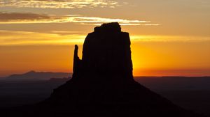 Preview wallpaper rock, mountain, silhouette, sunset