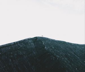 Preview wallpaper rock, mountain, silhouettes, top, sky, minimalism