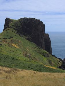 Preview wallpaper rock, mountain, slope, cliff, grass