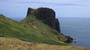 Preview wallpaper rock, mountain, slope, cliff, grass