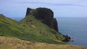 Preview wallpaper rock, mountain, slope, cliff, grass