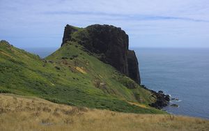 Preview wallpaper rock, mountain, slope, cliff, grass