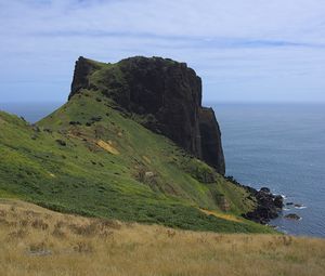 Preview wallpaper rock, mountain, slope, cliff, grass